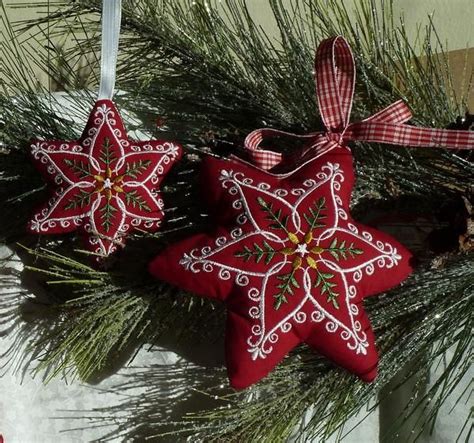 Two Red Ornaments Hanging From A Christmas Tree