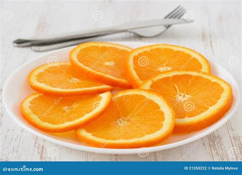 Cut Orange On A Plate Stock Photography Image 21350222