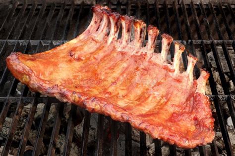 BBQ Baby Back Pork Ribs On The Hot Flaming Grill Stock Photo Image Of Meat Fire