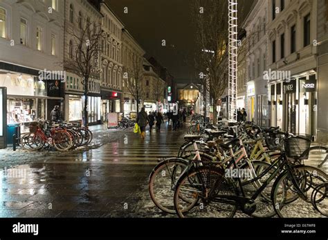 Walking street with melting snow in the center of Aarhus, Denmark, in ...