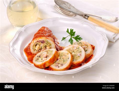 Stuffed calamari in tomato sauce Stock Photo - Alamy