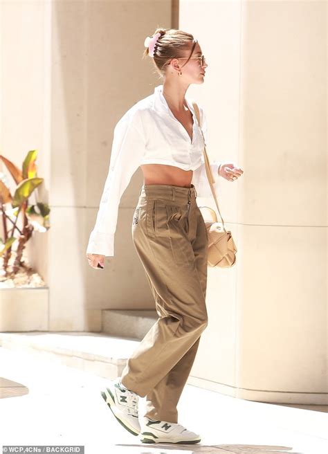 Hailey Bieber Flaunts Taut Tummy In Cropped Blouse In Beverly Hills