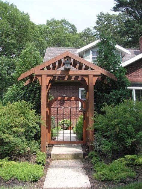 Pergola As Entrance Acting As The Entranceway To A Private Garden