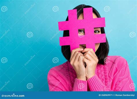 Photo Of Positive Girl Hands Hold Paper Hashtag Symbol Look Through