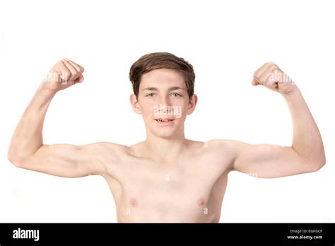 White teenage boy flexing his muscles. Showing off Stock Photo - Alamy