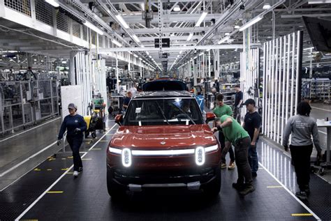 Rivian Stock Drops As Full Year Loss Projection Widens But Modest