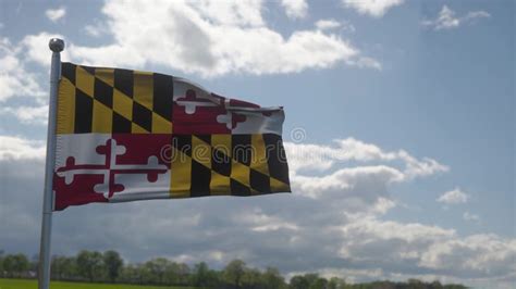 Maryland Flag On A Flagpole Waving In The Wind In The Sky State Of