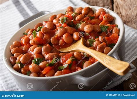 Organic Borlotti Beans In Tomato Sauce With Herbs Close Up In A Stock