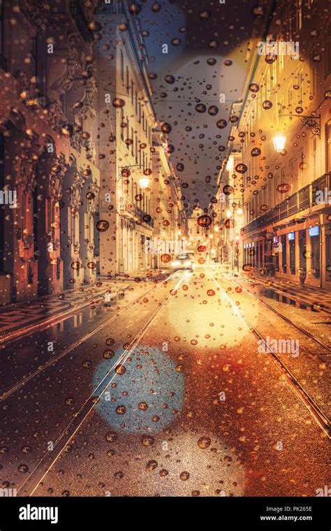 Rainy day in the city at night, traffic car and city lights on the street Stock Photo - Alamy