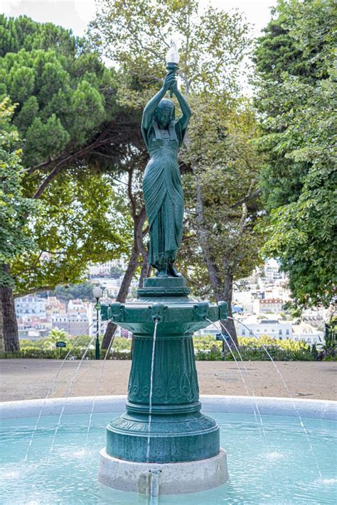 Green Statue Of Thinker Auguste Rodin Setting Naked On A Rock