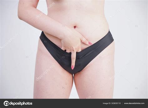 Plus Size Model Standing Naked And Showing Middle Finger On White Studio Background Alone Stock