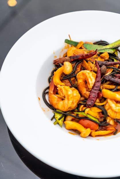 Premium Photo Spicy Black Spaghetti With Shrimps Tom Yum Kung