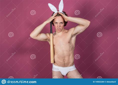 Funny Naked Guy Wearing Bunny Ears With Baseball Bat Over Pink Background Stock Photo Image Of