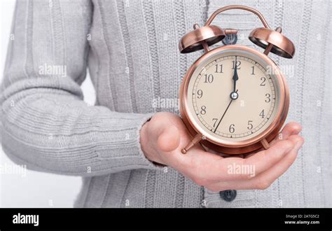 It S Time Man S Hand Is Holding An Alarm Clock Stock Photo Alamy