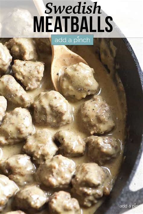 Swedish Meatballs Are Being Cooked In A Skillet With A Wooden Spoon And