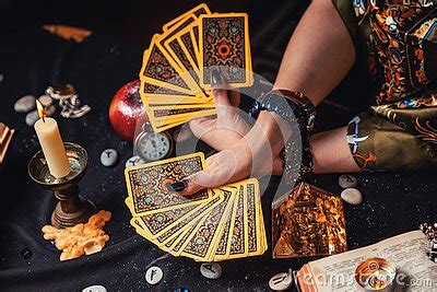 Astrology And Esotericism A Fortune Teller Holds A Fan Of Tarot Cards