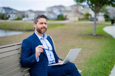 Premium Photo Freelance Businessman Freelancer In Suit Sitting On