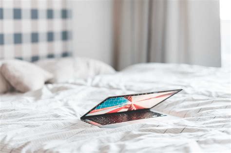 Laptop Lying in a Bed | Free Technology Image by picjumbo