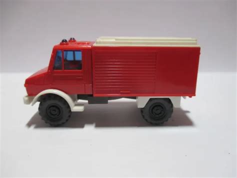 WIKING MODELLAUTO MERCEDES Benz Unimog U 1300 TLF Feuerwehr rot weiß 1