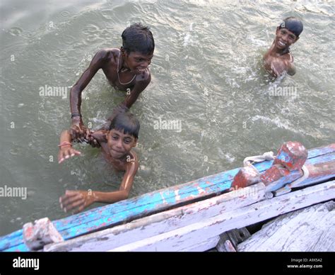 Children Swimming In The Ganges Stock Photo Alamy