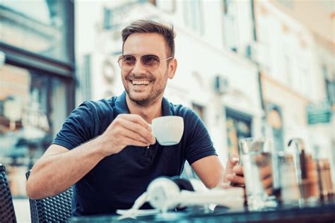 Premium Photo Young Man Drinks Coffee Outdoor