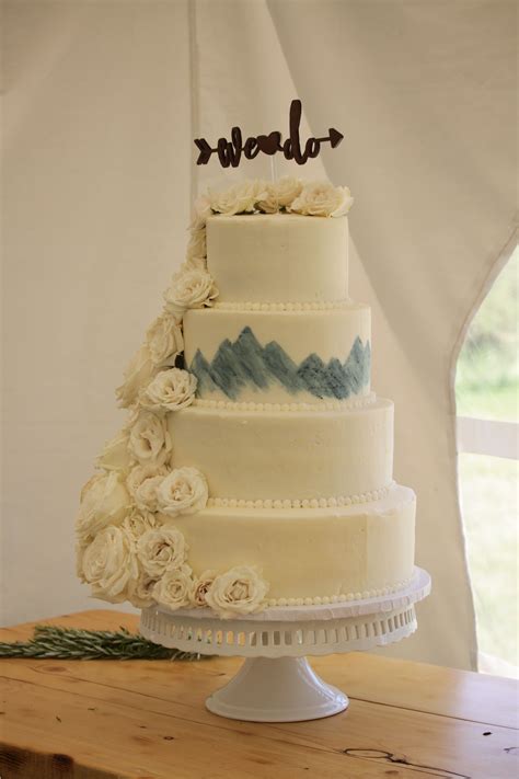 Elegant Buttercream Mountain Cake With Cascading Roses Blue And White