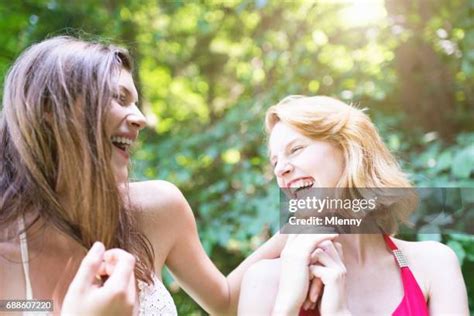 Tickling Beautiful Women Stockfotos En Beelden Getty Images