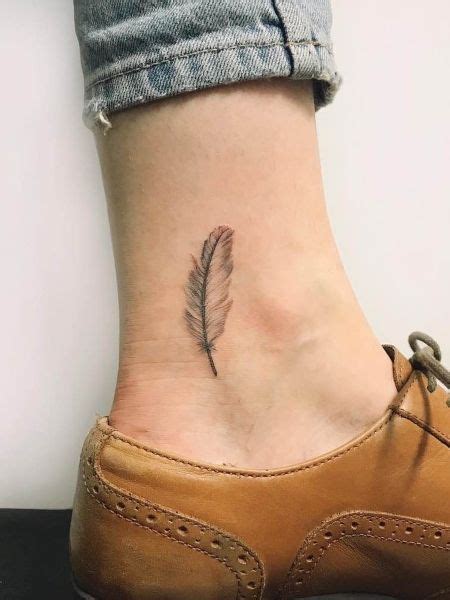 25 Symbolic Feather Tattoo Designs Meaning Small Feather Tattoo