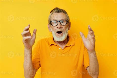 Senior Grey Haired Man Wearing Glasses Yellow Shirt Posing Isolated