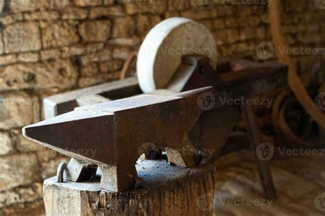 Anvil and a grinding wheel 24937347 Stock Photo at Vecteezy