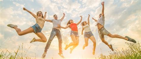 Premium Photo The Five Friends Jumping On The Grass On The Sunny