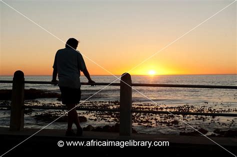 Photos And Pictures Of Man Watching The Sunset Sea Point Cape Town