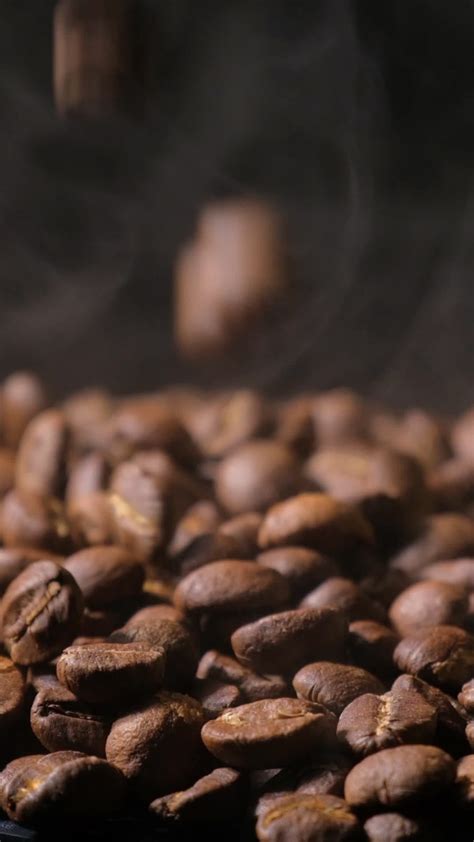 Vertical Slow Motion Of Roasted Coffee Beans Falling Organic Coffee