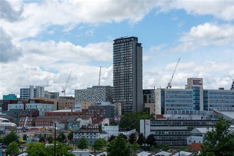 City Skyline under Cloudy Sky · Free Stock Photo