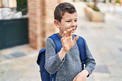 Blond Child Student Smiling Confident Saying Hello At Street Stock