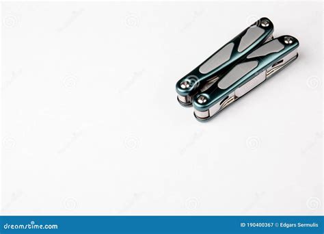 Compact Multitool On White Background Tools For Cutting Sawing