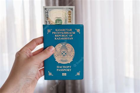 Premium Photo | National passport republic of kazakhstan in the hand ...