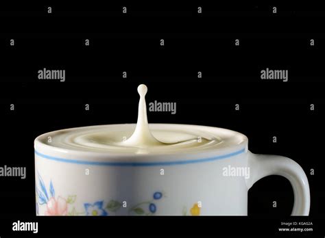 Milk drop splash Stock Photo - Alamy