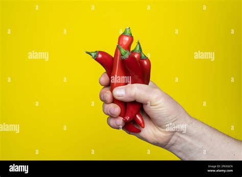 Some Red Hot Chili Peppers In The Hand Stock Photo Alamy