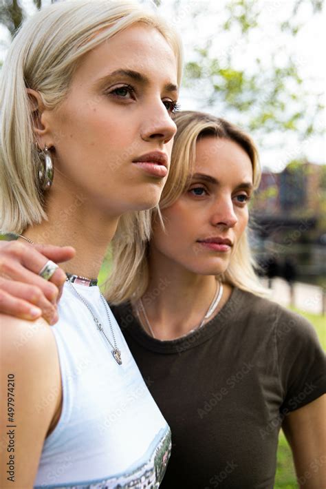 Lesbian Couple Embracing Looking In A Distance Stock Photo Adobe Stock