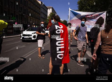 Protesters With Cuban Flags During The Demonstration With The Slogan