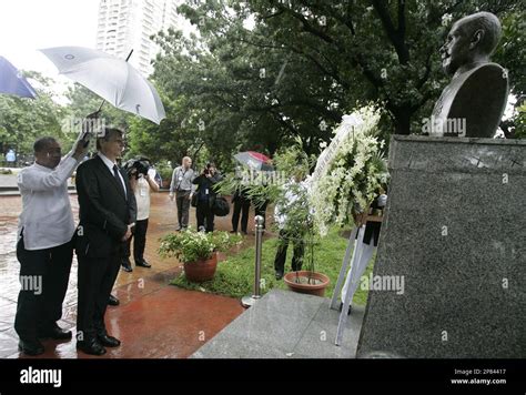 Czech Prime Minister Jan Fischer Second From Left Is Covered With An