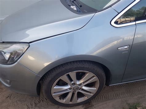 OPEL ASTRA J IV 4 BLOTNIK LEWY PRZOD PRZEDNI Z179 12589981743