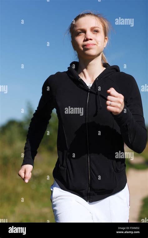 Girl Running In The Park Close Up Stock Photo Alamy