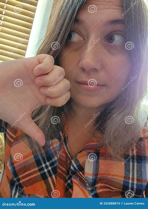 Thumbs Down Brunette Woman Looking Aside Stock Photo Image Of