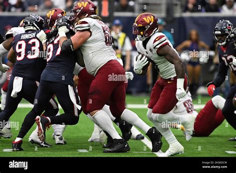 Washington Commanders Running Back Brian Robinson Jr Runs Behind