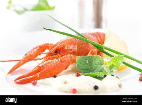 Red Boiled Crayfish With Sauce And Herbs Stock Photo Alamy