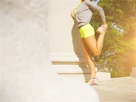 Fit Woman Stretching Legs Outdoors