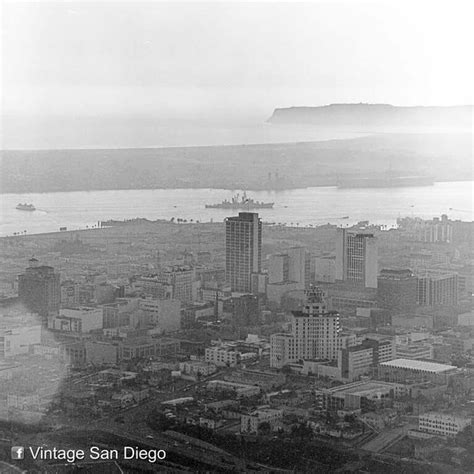 An Aerial View Of A City With Ships In The Water