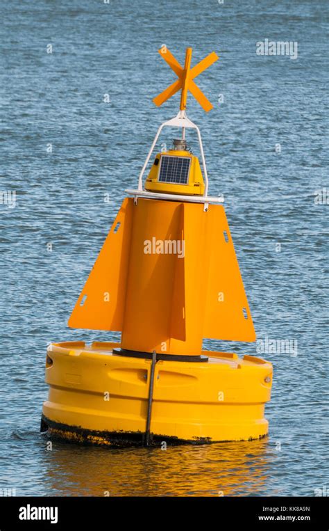 A Yellow Buoy Is Floating On The Water Surface In The Port Of Rotterdam